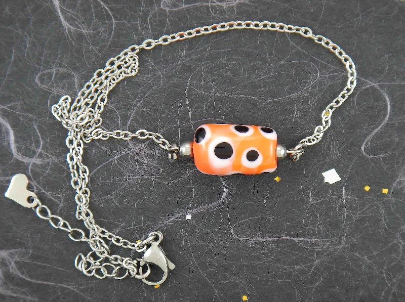 stylish pendant necklaces for women -14-inch necklace with bright orange glass cylinder, black and white dots (Murano-style glass handmade in Montreal), stainless steel chain