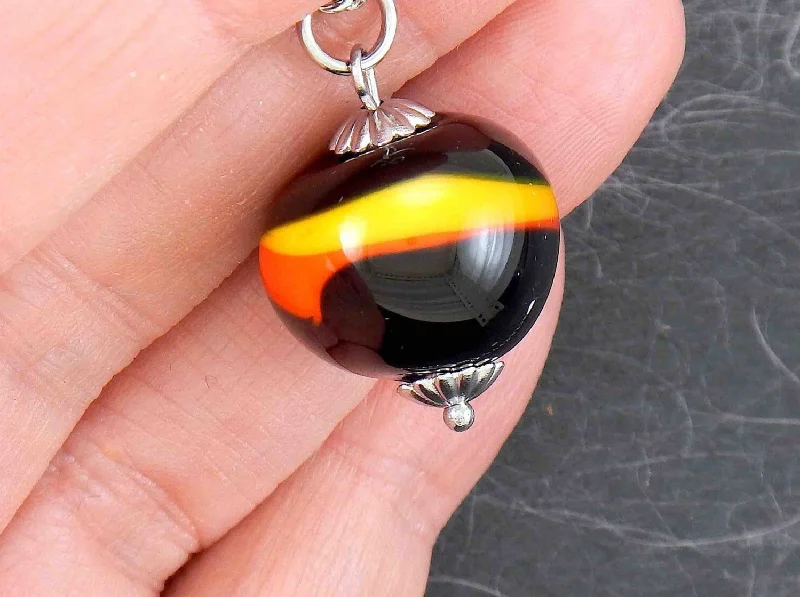 layered gemstone necklaces for women -14-inch necklace with funky black ball marbled in red and yellow (Murano-style glass handmade in Montreal), stainless steel chain